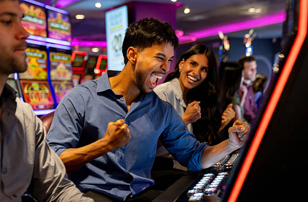 gwk slot arcade games interface on mobile phone showing game grid and stake controls